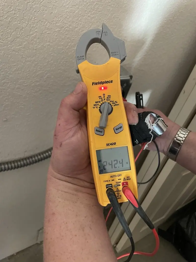 Voltage testing with clamp meter during Generator Installation in Summerfield